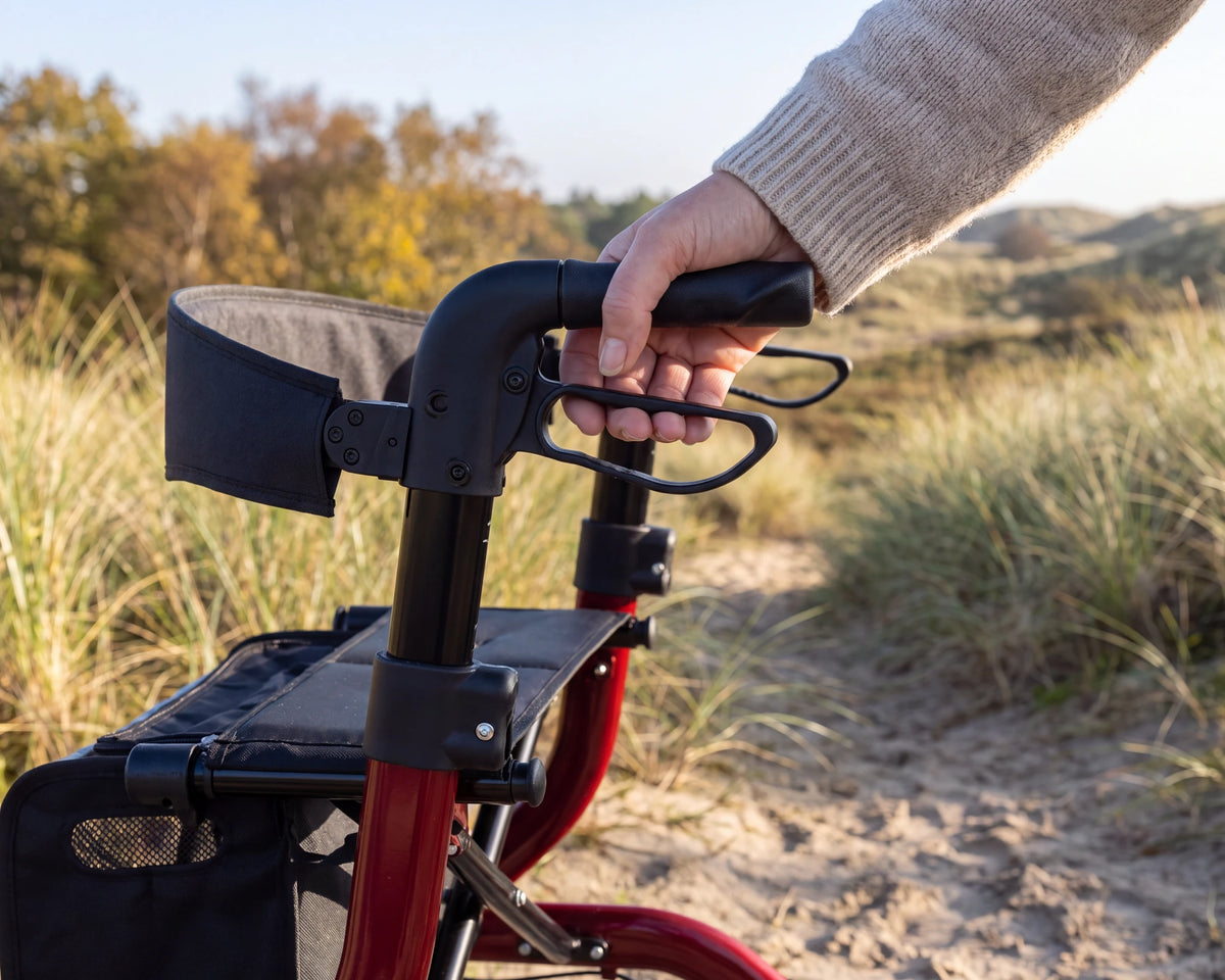 A hand on the handle and brake lever of the Parvum SuperLight Plus in red.